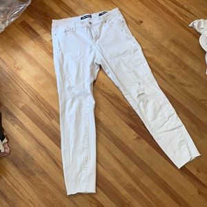 Slim leg distressed white jeans